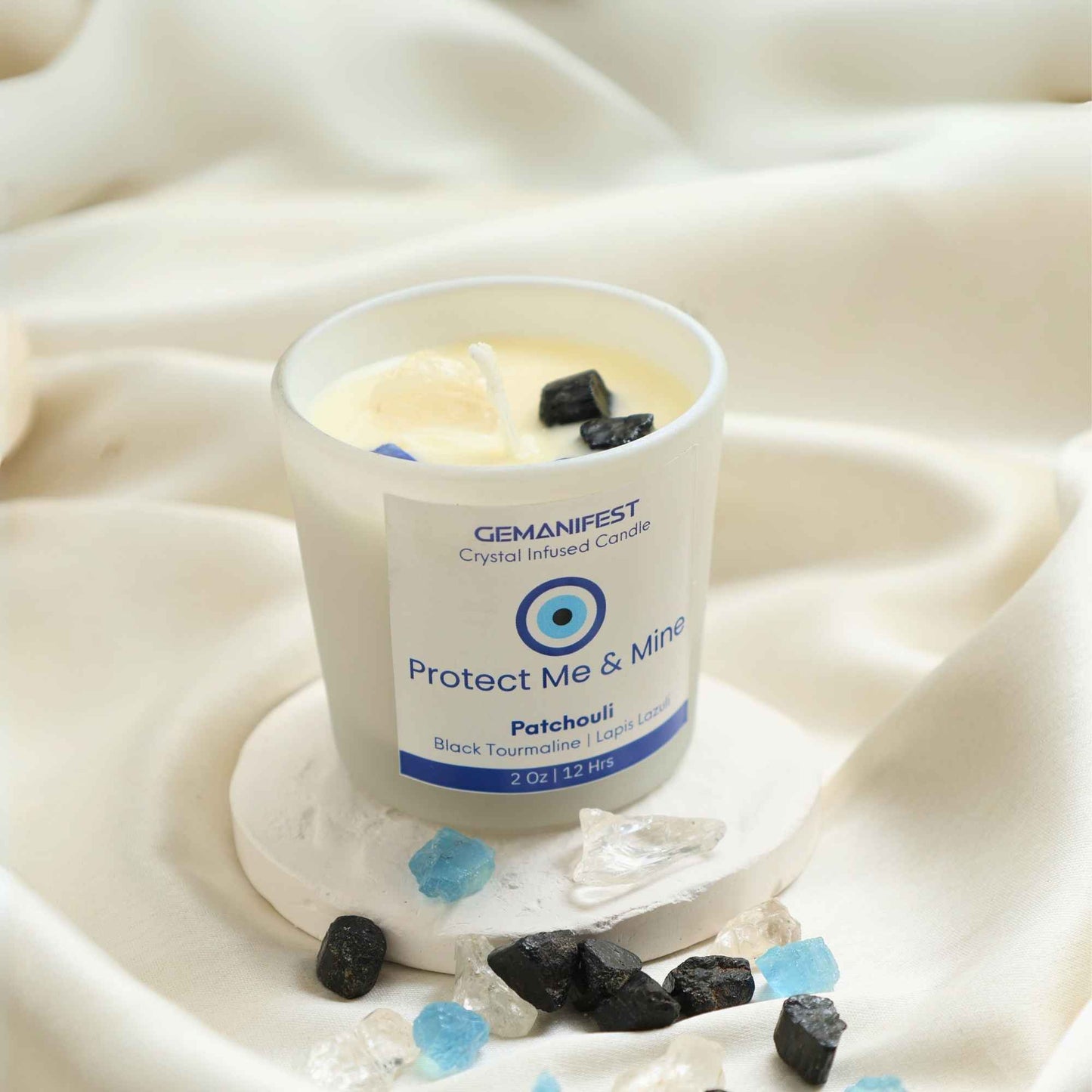 Protect Me & Mine Manifestation Candle with Black Tourmaline and Lapis Lazuli crystals and Patchouli essential oil for protection and grounding.