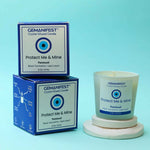 Protect Me & Mine Manifestation Candle with Black Tourmaline and Lapis Lazuli crystals and Patchouli essential oil for protection and grounding.
