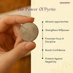 Hand holding a pyrite coin with its benefits listed on a beige background