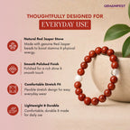 Red jasper stone bracelet with product features on a beige background