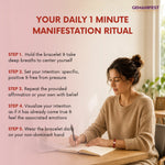 Woman sitting at a desk with a notebook and pen, with text about a daily manifestation ritual on a light background.