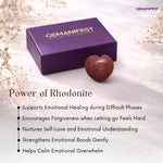 Purple box with 'GEMANIFEST' branding and a rhodonite heart on a light background.