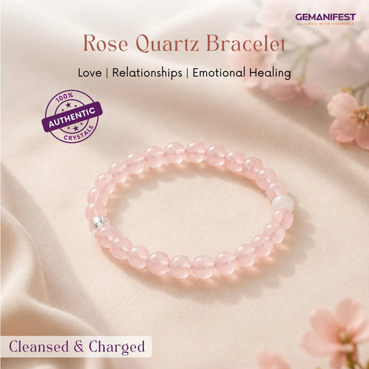 Rose Quartz bracelet on a soft fabric background with flowers, featuring GEMANIFEST branding.