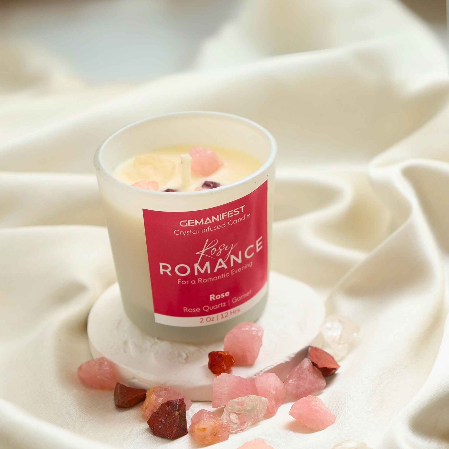 Rosy Romance Manifestation Candle with Rose Quartz and Garnet crystals and Rose essential oil for love and passion.