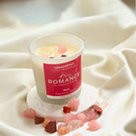 Rosy Romance Manifestation Candle with Rose Quartz and Garnet crystals and Rose essential oil for love and passion.