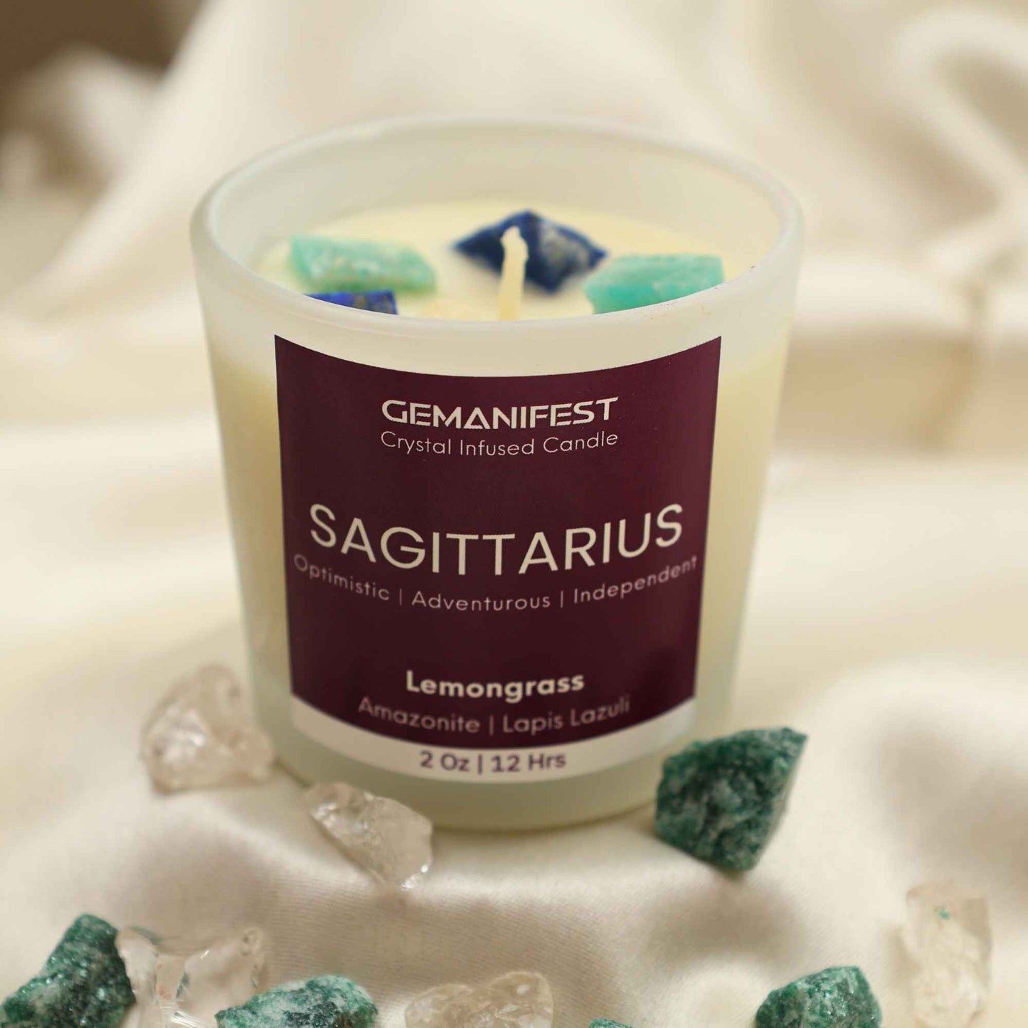 Sagittarius Zodiac Manifestation Candle with Amazonite and Lapis Lazuli crystals and Lemongrass essential oil for optimism and adventure.