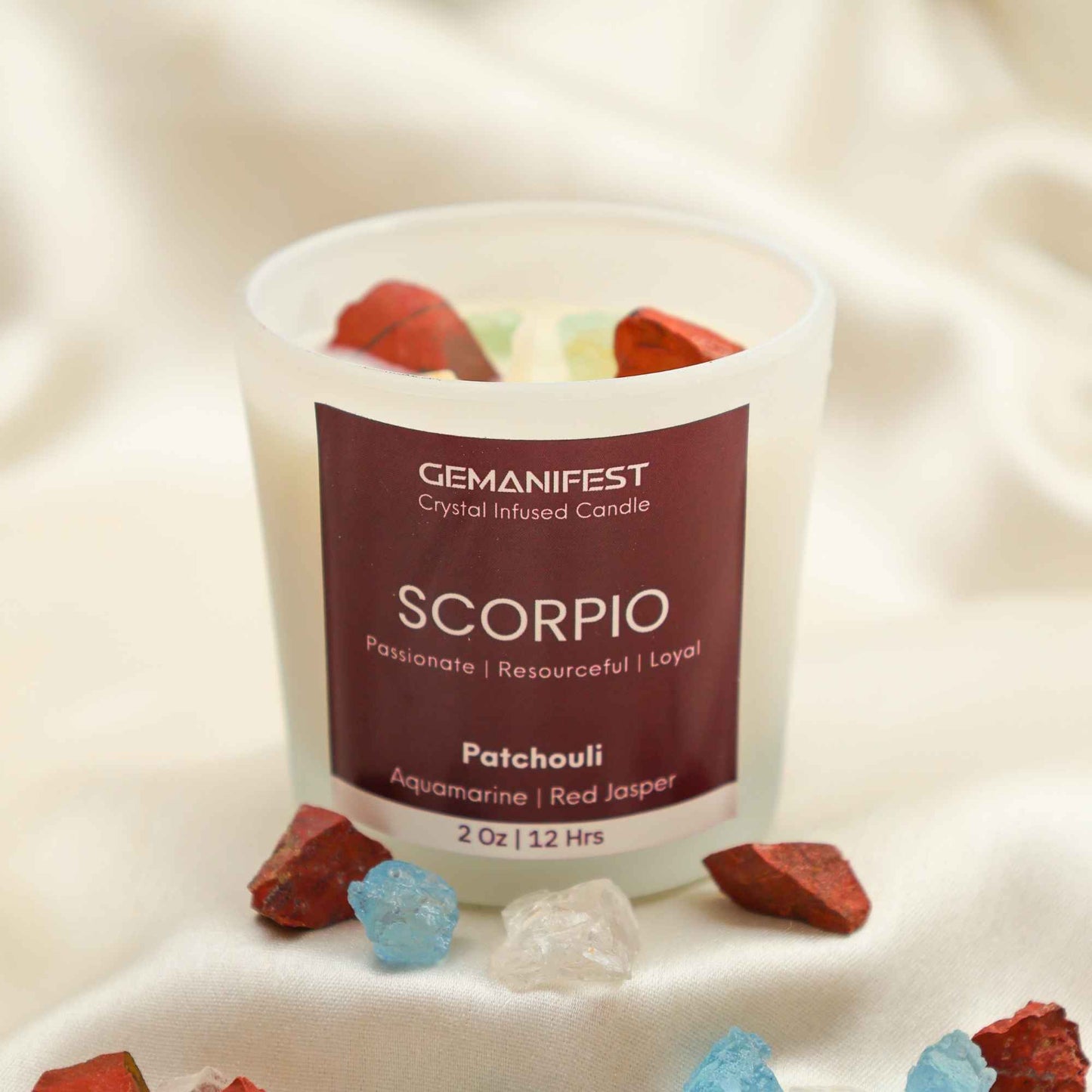 Scorpio Zodiac Manifestation Candle with Aquamarine and Red Jasper crystals and Patchouli essential oil for transformation and protection.