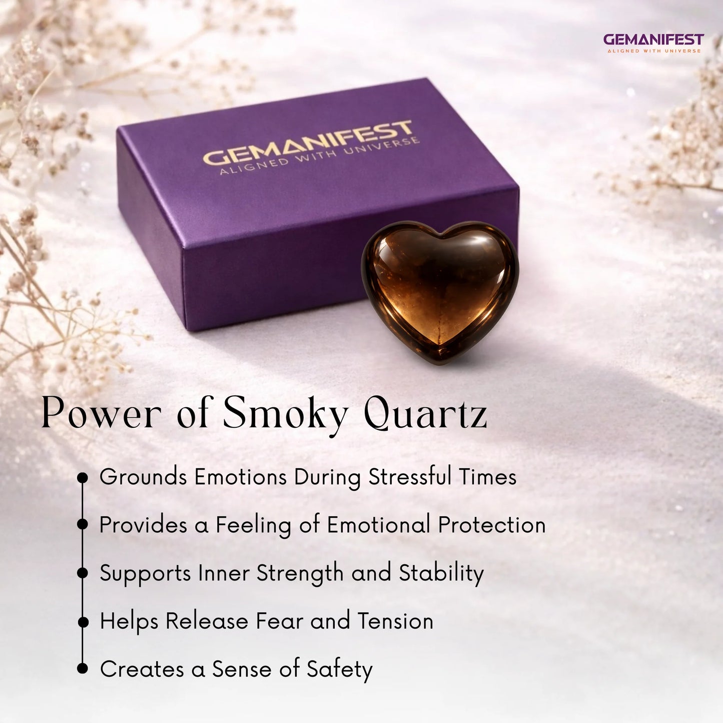Heart-shaped smoky quartz crystal with Gemanifest box on a light background