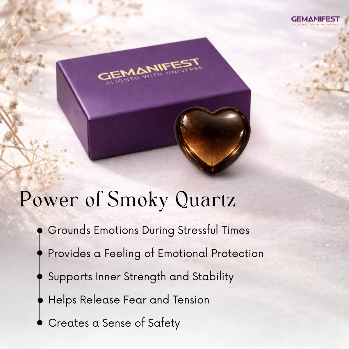 Heart-shaped smoky quartz crystal with Gemanifest box on a light background