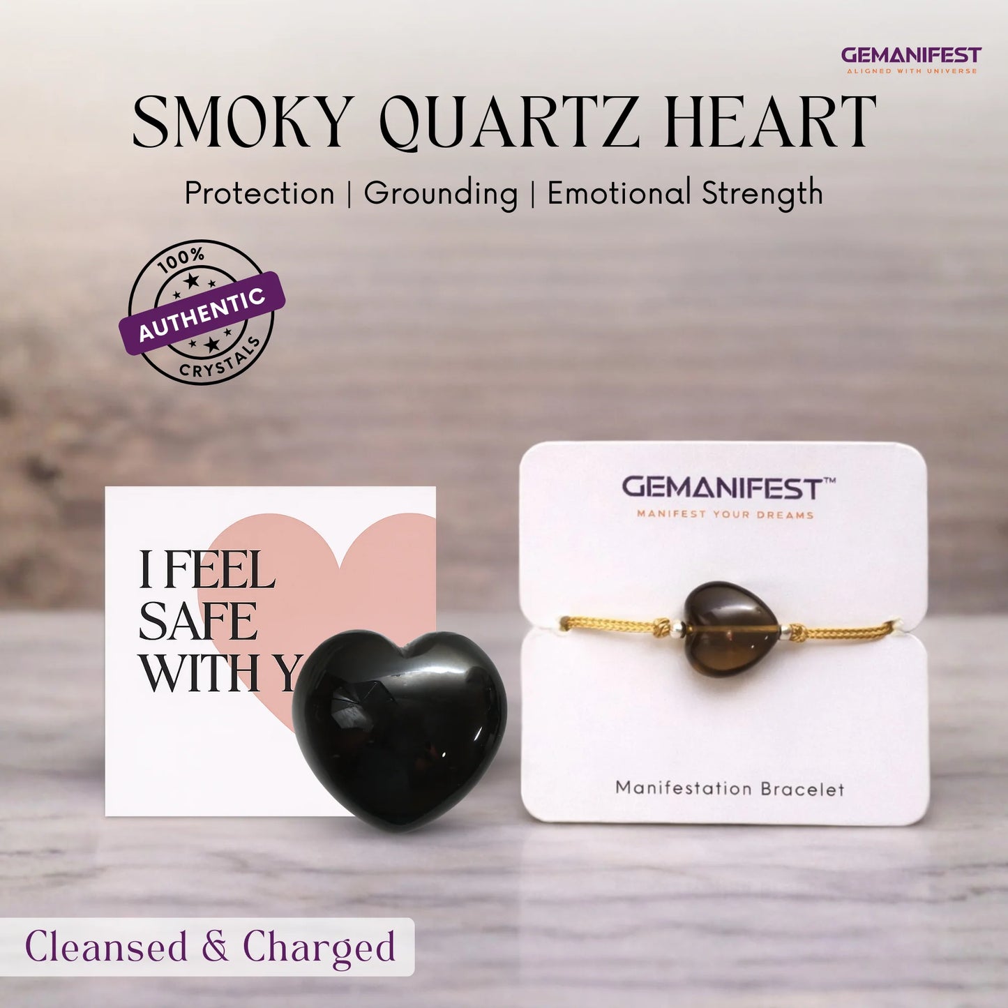 Smoky quartz heart and Gemanifest bracelet on a wooden surface with a neutral background