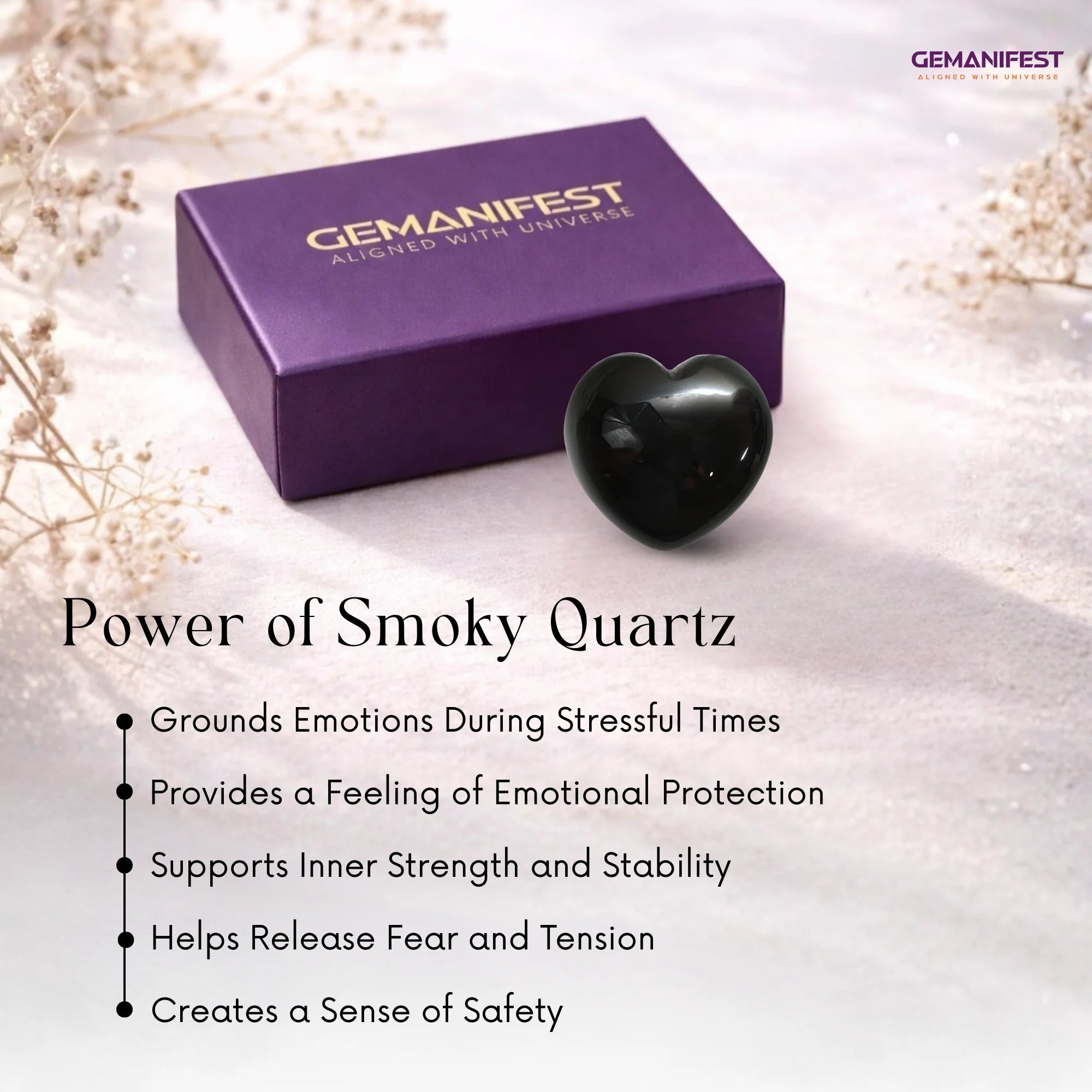 Heart-shaped smoky quartz crystal with Gemanifest box on a light background