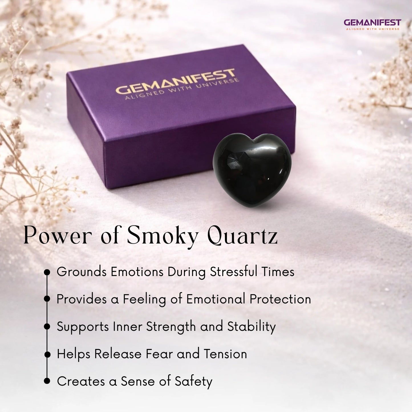 Heart-shaped smoky quartz crystal with Gemanifest box on a light background