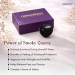 Heart-shaped smoky quartz crystal with Gemanifest box on a light background