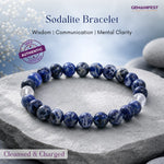 Sodalite bracelet on a stone surface with GEMANIFEST branding and product details.