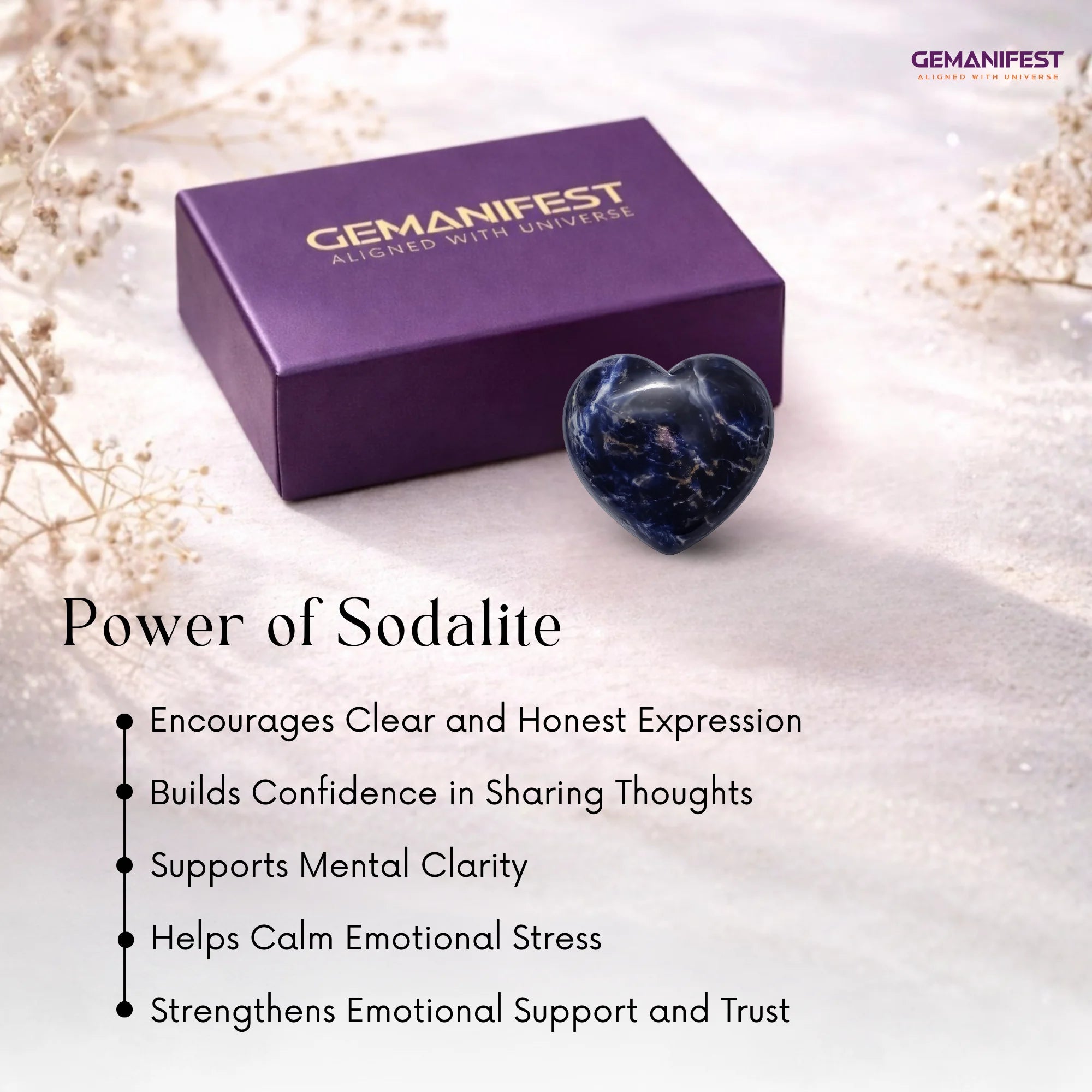 Heart-shaped sodalite stone with Gemanifest box on a soft background