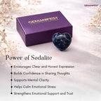 Heart-shaped sodalite stone with Gemanifest box on a soft background