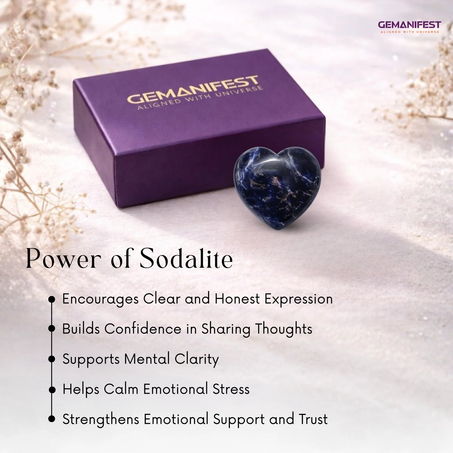 Heart-shaped sodalite stone with Gemanifest box on a soft background