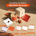 GEMANIFEST product set with candles, cards, and other items on a wooden surface.