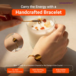 Hand holding a cup with a handcrafted bracelet on a light background, featuring GEMANIFEST branding.