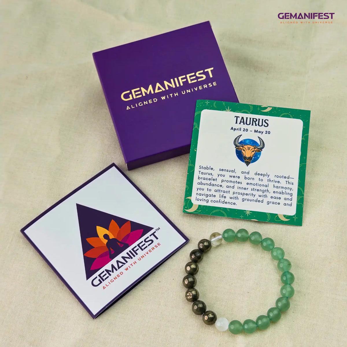 Gemanifest bracelet, card, and packaging on a beige background
