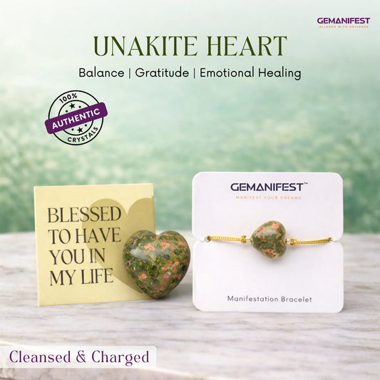 Unakite heart crystal and bracelet on a wooden surface with 'GEMANIFEST' branding.