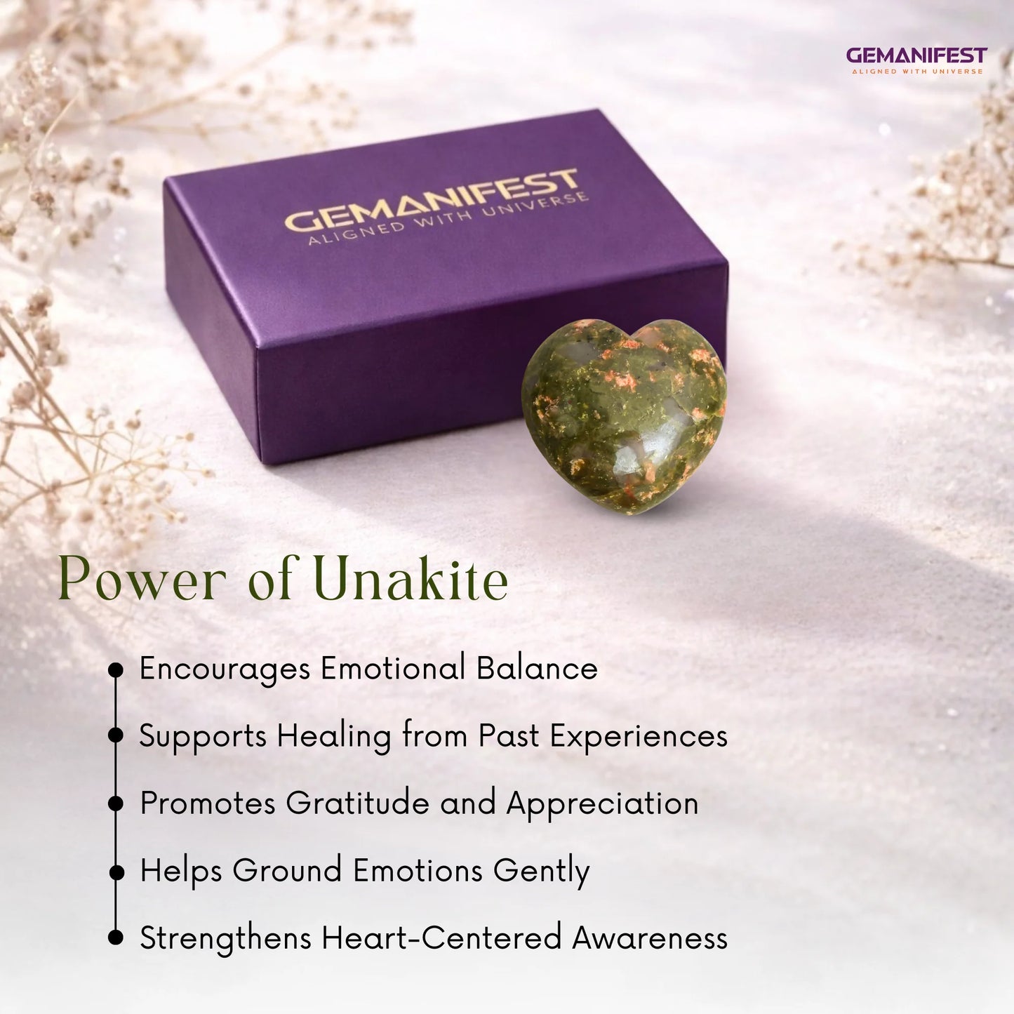Gemanifest unakite stone and packaging on a soft background