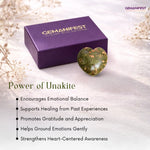 Gemanifest unakite stone and packaging on a soft background