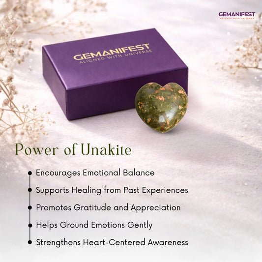 Unakite heart crystal and bracelet on a wooden surface with 'GEMANIFEST' branding.